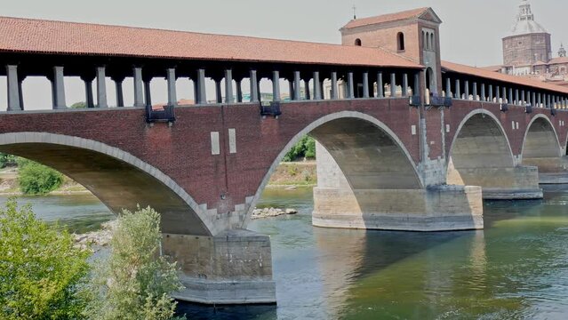 Historic post-war covered bridge in pavia built over the Ticino river