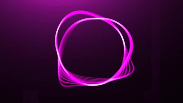 Abstract flexible ring isolated on a dark background. Motion. Transforming circle silhouette with moving shapes.