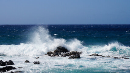 waves crashing on rocks