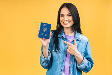 Portrait of nice beautiful lovely glad cheerful woman holding in hands ukrainian passport, having...