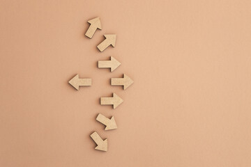 Business investment growth concept , Wooden arrows on beige background. Space for your text