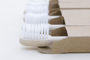 A family set of five eco friendly wooden bamboo toothbrushes.