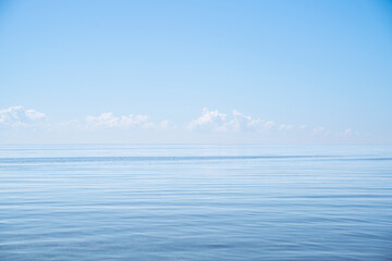Fototapeta na wymiar Calm Sea Ocean And Blue Sky Background. High quality photo