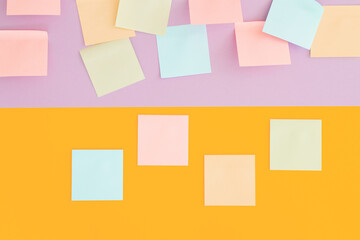 Colorful sticky notes on yellow and violet background.