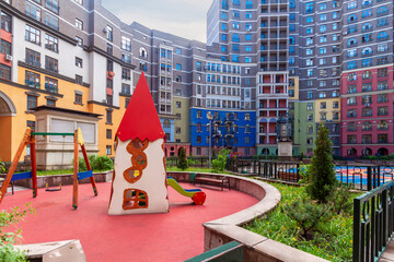Empty children playground park with playground equipment. Outdoor playground with house building...