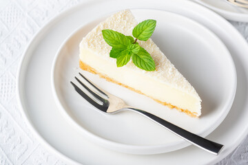 Cheesecake in a plate on a white table