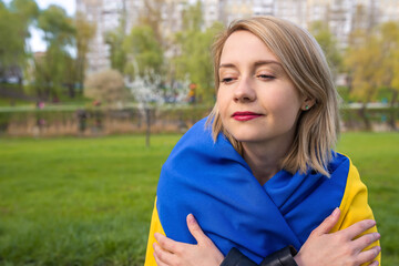 Naklejka premium Outdoor portrait of a young Ukrainian woman in the park.