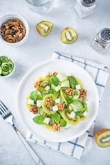 Kiwi cucumber mint salad in a plate