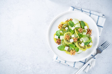 Kiwi cucumber mint salad in a plate