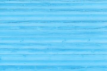 Blue background. Old wooden wall cracked from time to time painted blue.