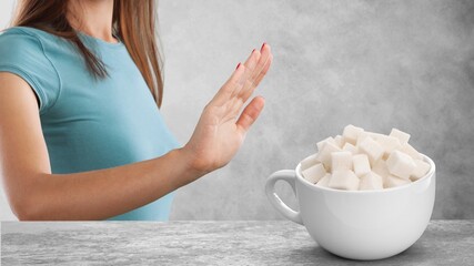 Woman refusing sugar. Health care concept, Diabetes prevention background