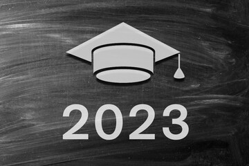 Graduation hat with number 2023 on background. Education, leaning, class 2023 concept