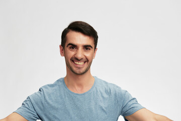 portrait man in blue t-shirts gesture hands emotion isolated background
