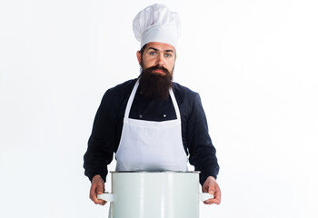 Male chef in cook uniform and apron with pot or saucepan. Cooking, culinary and food. Kitchenware.