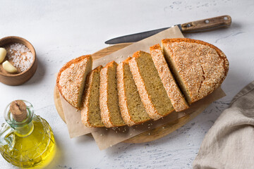 Delicious healthy gluten free lentil bread without flour with sesame seeds in a white baking dish...