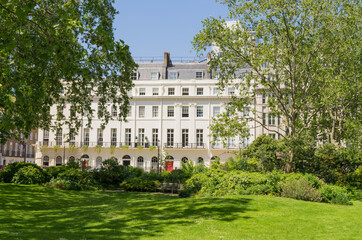 Fitzroy Square Garden in Fitzrovia on a hot sunny day. London