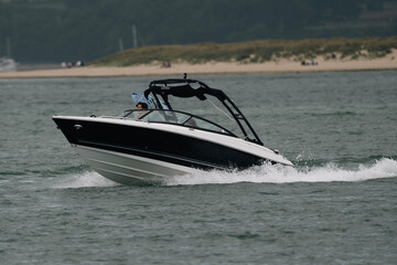 Fototapeta premium Speed Boat At Speed Pole
