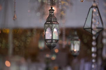 Decorative antique style hanging gothic lantern glowing