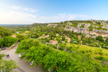 View of the valley and Alpilles Mountains from a terrace at the medieval stone and rock village of Les Baux-de-Provence near the Cote d'Azur region of Southern France.