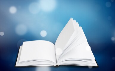 Old book or Holy Bible open on a table background with light