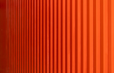 Abstract image of a textured red surface with lines, striped backgrounds..
