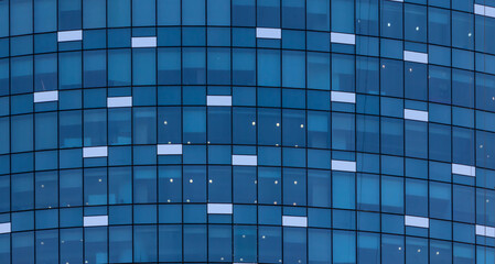 Abstract exterior architecture facade of  modern glass windows residential  building in Abu Dhabi