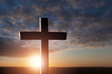 Classic wooden cross on sky background