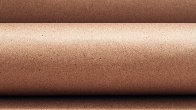 Rolled sheet craft paper close-up. Abstract background, copy space