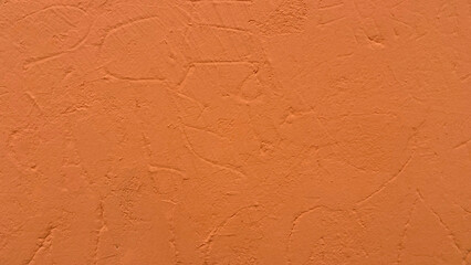 Rustic wall texture painted in pumpkin color