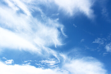 Bright blue sky with white clouds