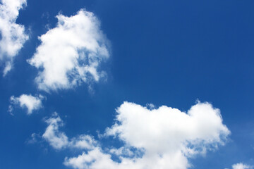 Naklejka na ściany i meble Bright blue sky with white clouds