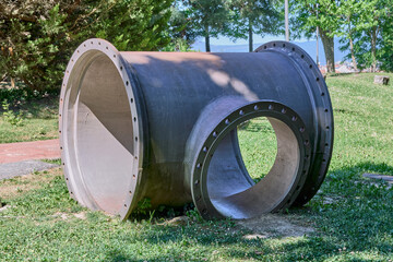 Old large t-shaped steel pipe. Selective focus.