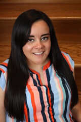 beautiful portrait of a woman on wooden stairs