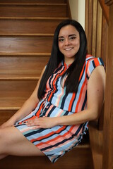 beautiful portrait of a woman on wooden stairs