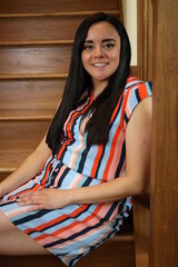 beautiful portrait of a woman on wooden stairs