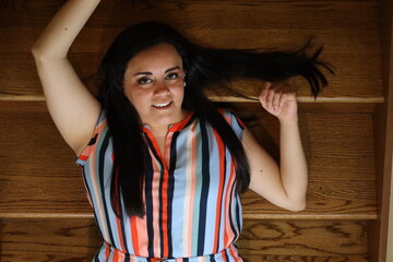 beautiful portrait of a woman on wooden stairs