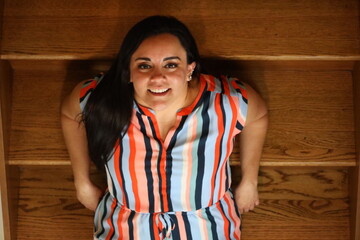 beautiful portrait of a woman on wooden stairs