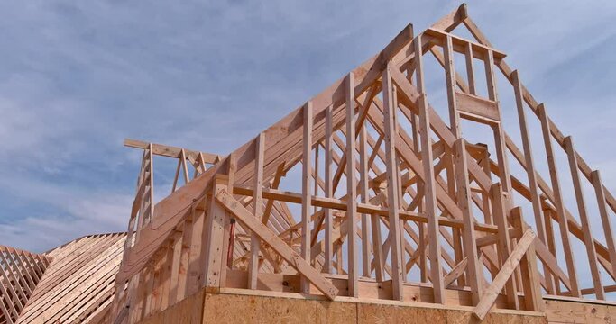 Roofing construction in wooden roof frame installation the truss beams structures on new house