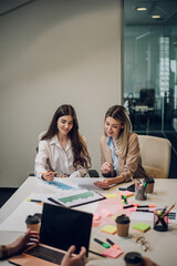 Two female colleagues having a meeting in an office