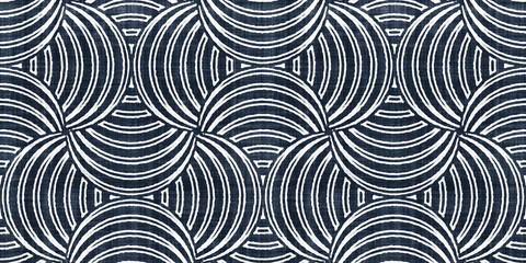 Seamless vintage mid century modern geometric optical illusion circle pattern on rough linen texture. Trendy dark indigo blue denim and white batik tribal ethnic interior and fashion surface design..