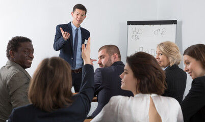 Male speaker giving talk on corporate business meeting in meeting room