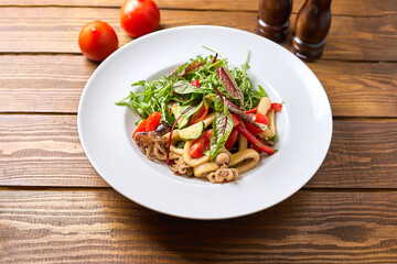Vegetable salad on a large white plate