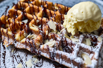 Belgian waffle with ice cream close