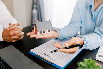 Real estate brokers or real estate agent with client or architect team Discussions about contracts , Saving money to invest in house or property in the future. Business property Concept.