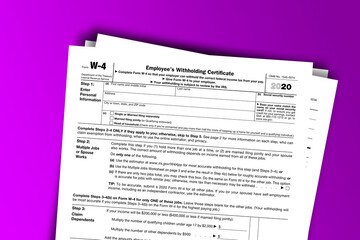 Fototapeta premium Form W-4 documentation published IRS USA 12.31.2020. American tax document on colored