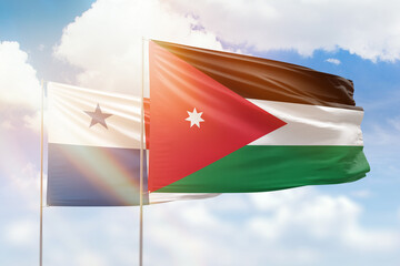 Sunny blue sky and flags of jordan and panama