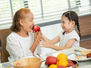 Child son girl kid female woman grandmother love hug play enjoy parent family apple fruit happy...