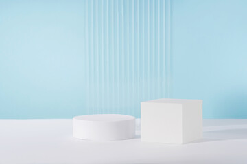 Acrylic ribbed plate, podium, background for cosmetic product packaging on blue backdrop. Showcase...