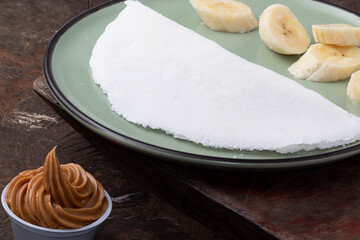 Brazilian tapioca served with banana and peanut butter.