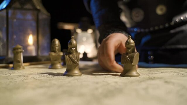 Commander in the medieval world.
Battle plan. Fighter. In the medieval headquarters, the commander makes the battle plan.
